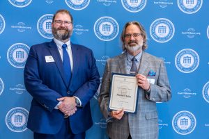 Michael Aday displays his 2024 Project Excellence Award from the East Tennessee Historical Society while standing with Warren Dockter, the organization’s president and CEO. Photo provided by the East Tennessee Historical Society. 