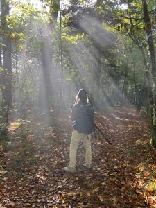 Judy Dykes stands in the morning sun on the Little Butt/Big Butt Trail. Photo provided by Anne Glover.