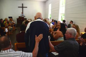 Harley Caldwell rises to be recognized as the only person born in Cataloochee Valley in attendance that day. Photo provided by Holly Kays, Smokies Life. 