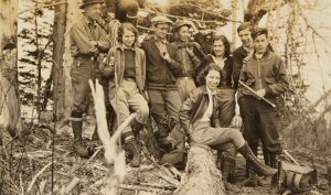 George Masa (center) stands with fellow members of the Carolina Mountain Club on Mount Kephart in Great Smoky Mountains National Park. Masa’s hand is on the shoulder of his friend Roger Morrow, who would serve as a pallbearer in Masa’s funeral. Photo courtesy of Wilson Special Collections, University of North Carolina at Chapel Hill.