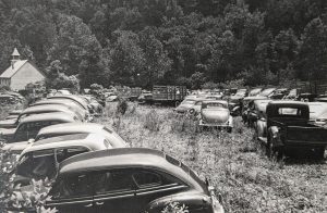 Cars fill the lawn at Palmer Chapel Methodist Church during the 1947 reunion of families in Cataloochee Valley. A contemporary article in The Waynesville Mountaineer reported that 650 people attended the event. Photo provided by Steve Woody.